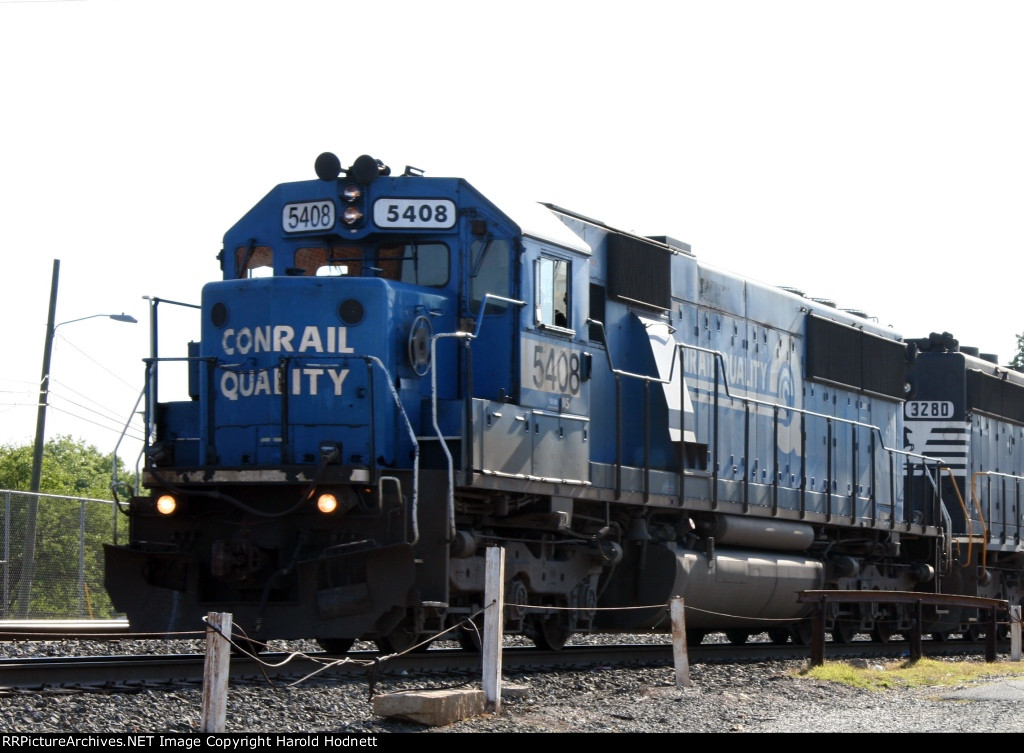 NS 5408 leads a train down the yard lead